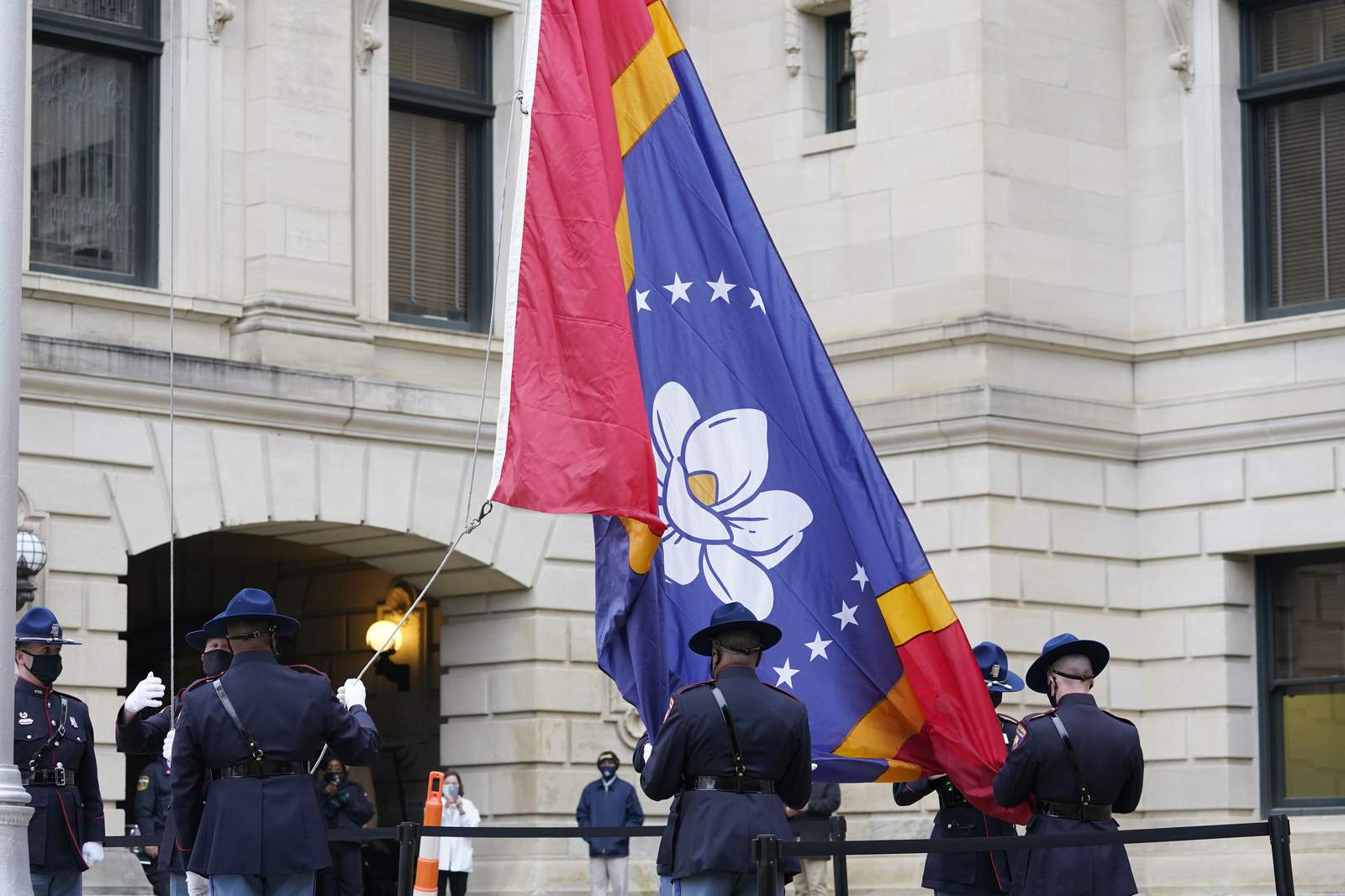 Mississippi governor signs law for flag without rebel emblem