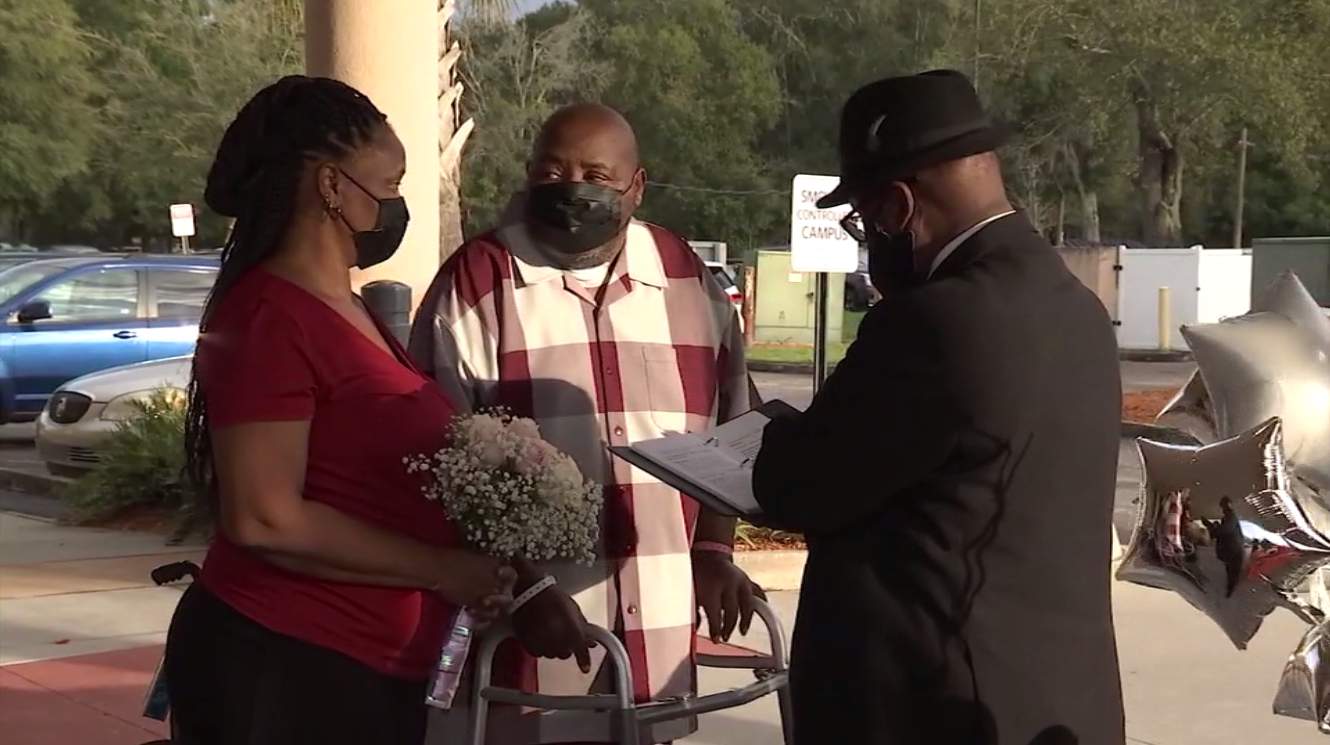 Coronavirus survivor & fiancée marry outside Orange Park Medical