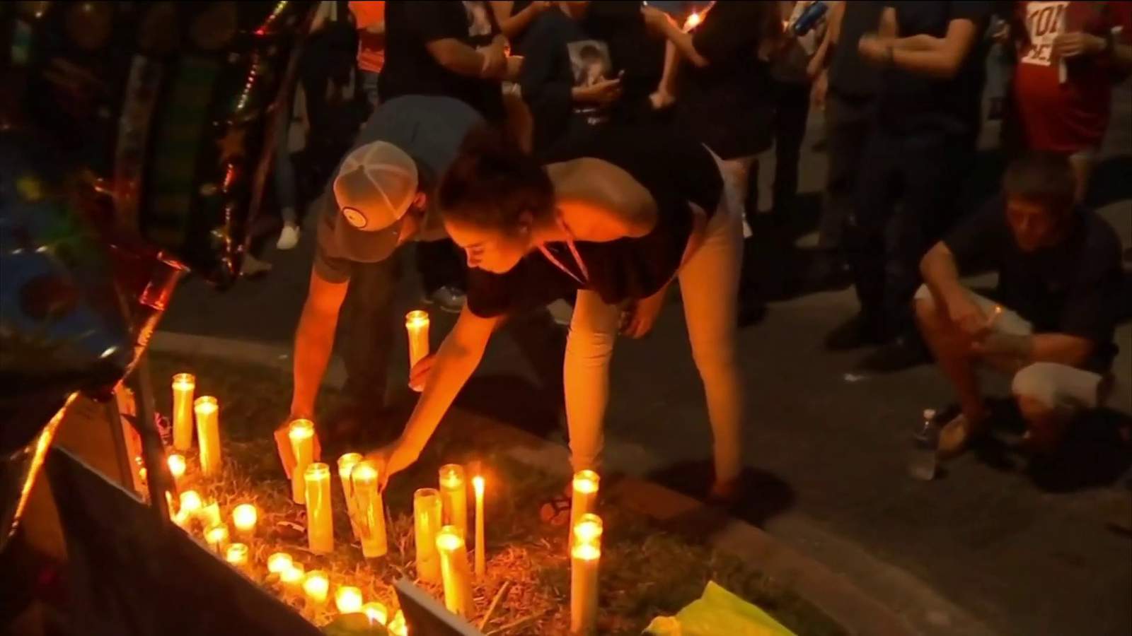 Candlelight vigil honors young couple killed in double shooting