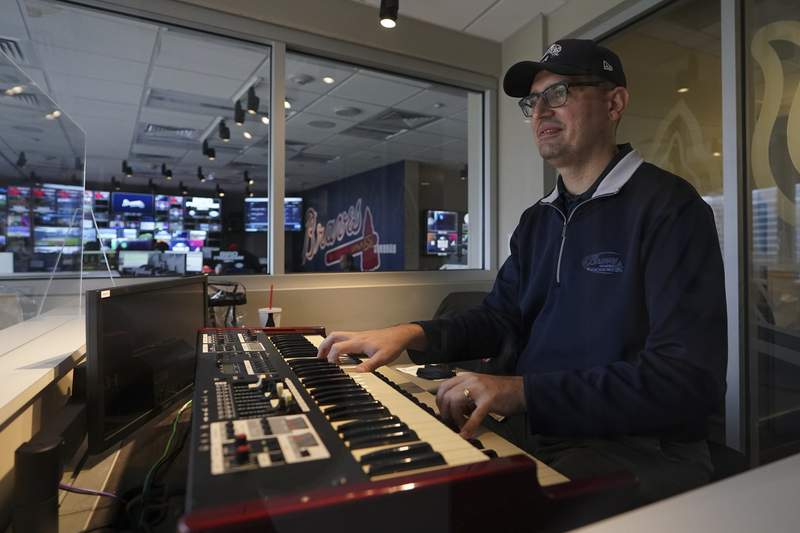 Play me a song: Braves organist charms fans, amuses players