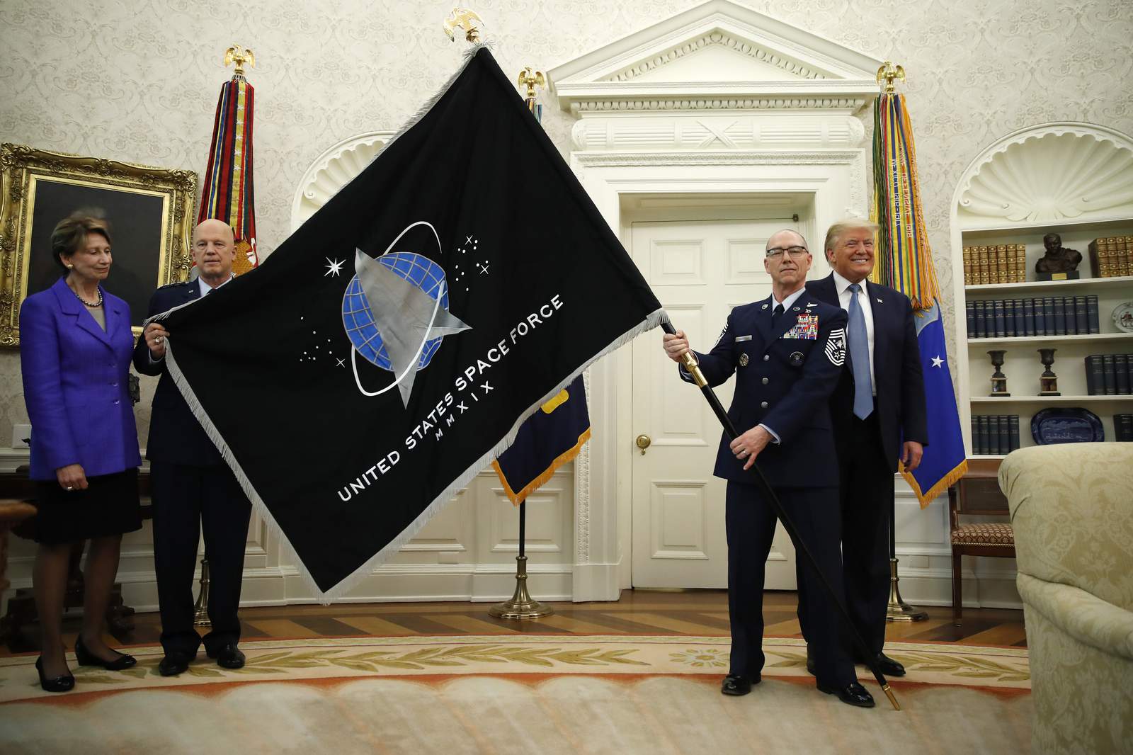 Space Force unveils flag; Trump touts super-duper missile