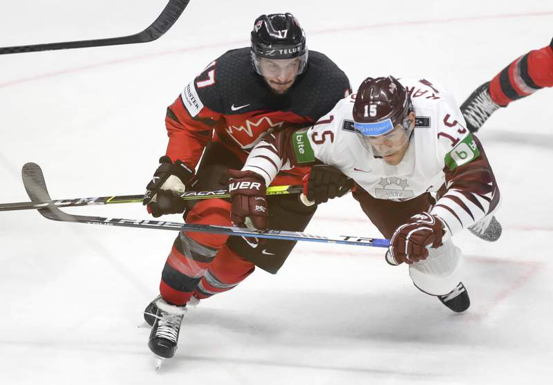 Host Latvia beats Canada 2-0 in world hockey opener
