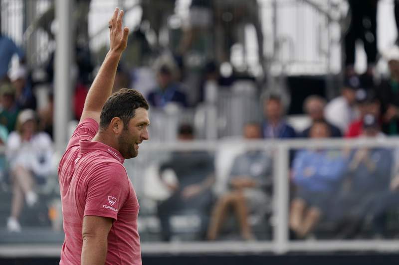 The Latest: Rahm closes with two birdies to win U.S. Open