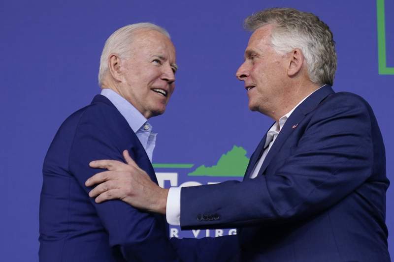 Biden stumps for McAuliffe in early test of political clout